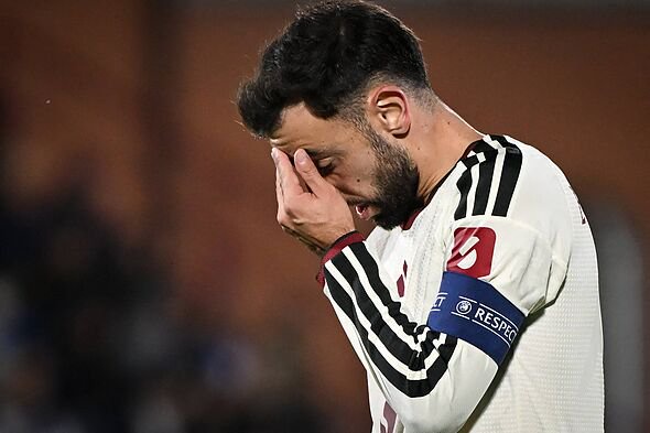 Bruno Fernandes holding his face.