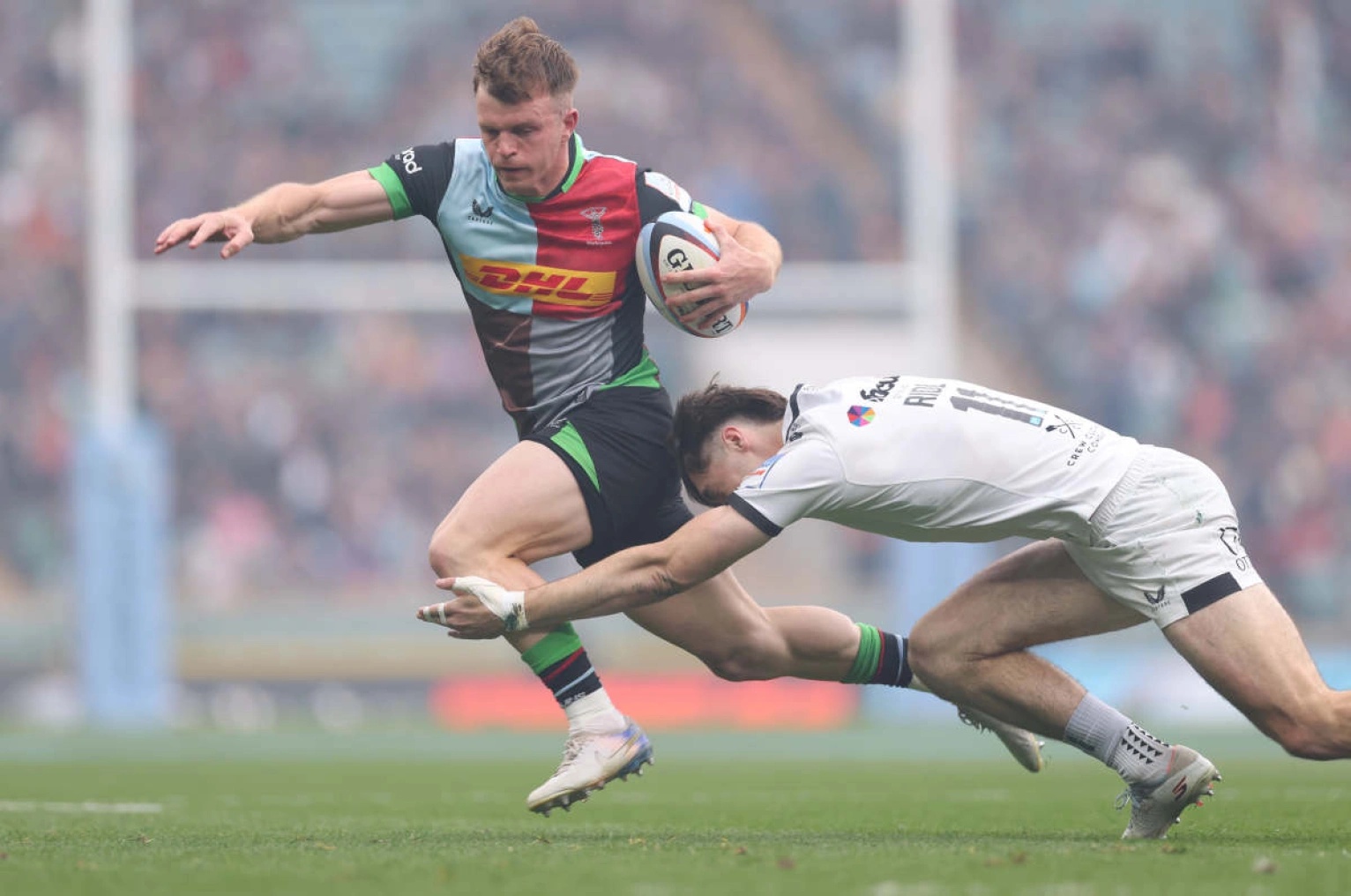 Jamie Benson evades a tackle for Harlequins