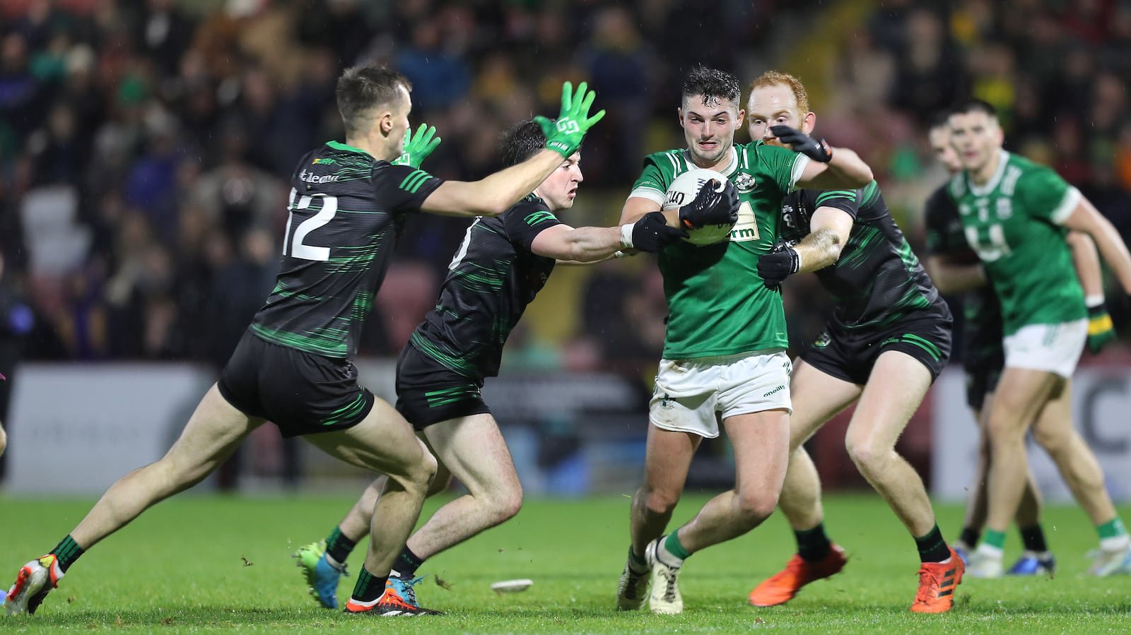 Newbridge's Mark McGrogan with Stevie O'Hara, Conleth McGuckian and Conor Glass of Glen in the Derry SFC final at Celtic Park