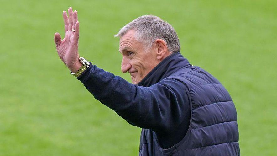 Tony Mowbray waves to fans 