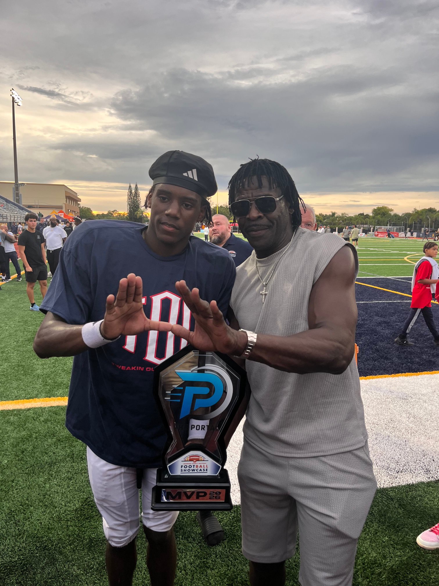 Columbus athlete and Miami commit A'mir Sears with former University of Miami star and Pro Football Hall of Famer Michael Irvin at St. Thomas Aquinas on Aug. 29, 2026. 