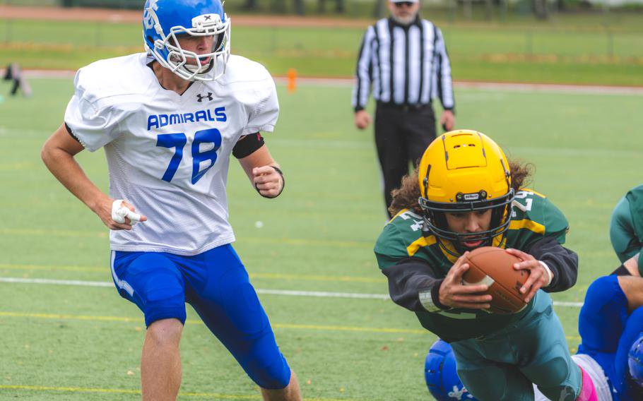 Michael McGlothlin dives with the football