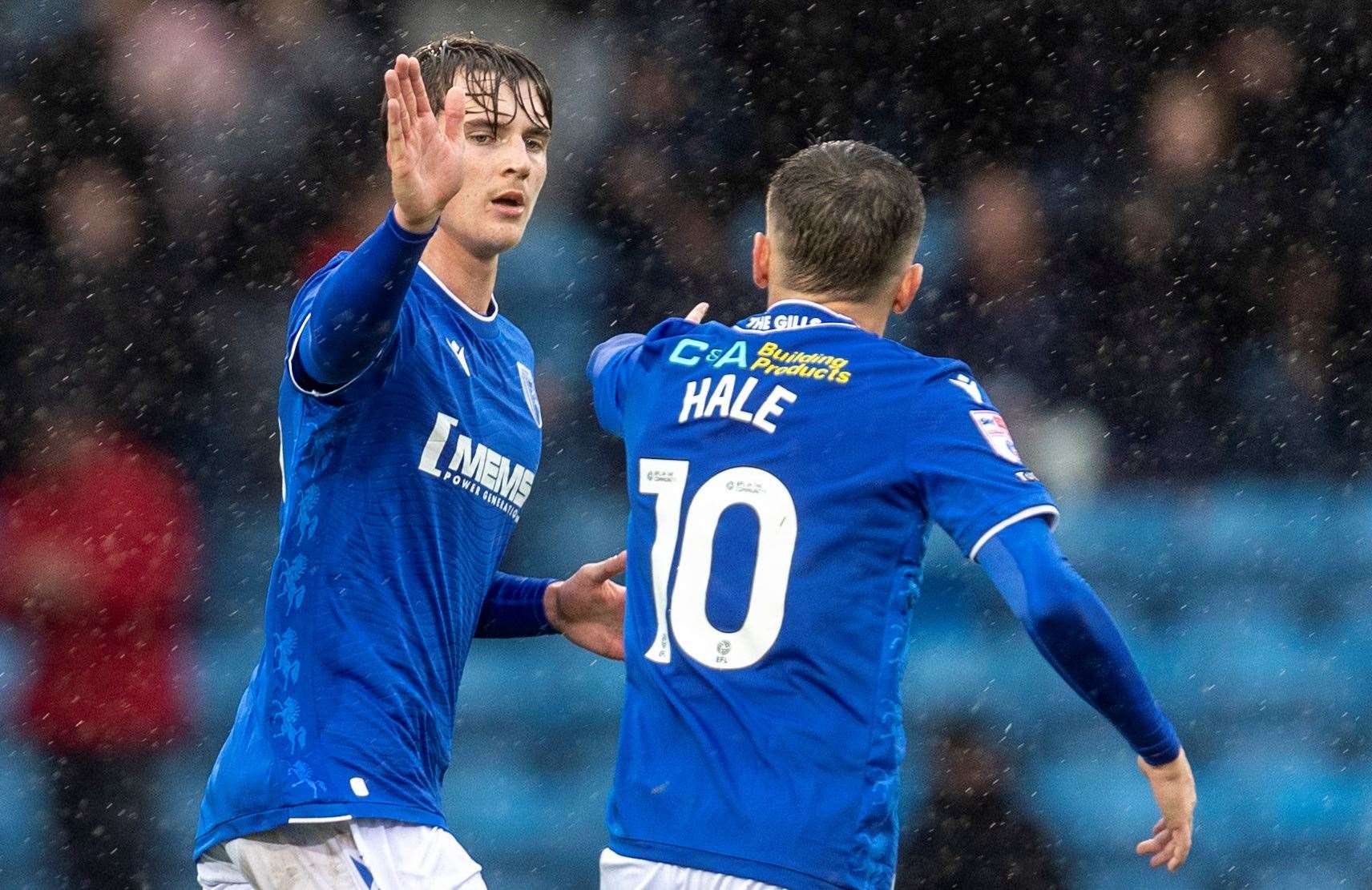 Ronan Hale is congratulated after his equaliser for Gillingham on Saturday Picture: @Julian_KPI