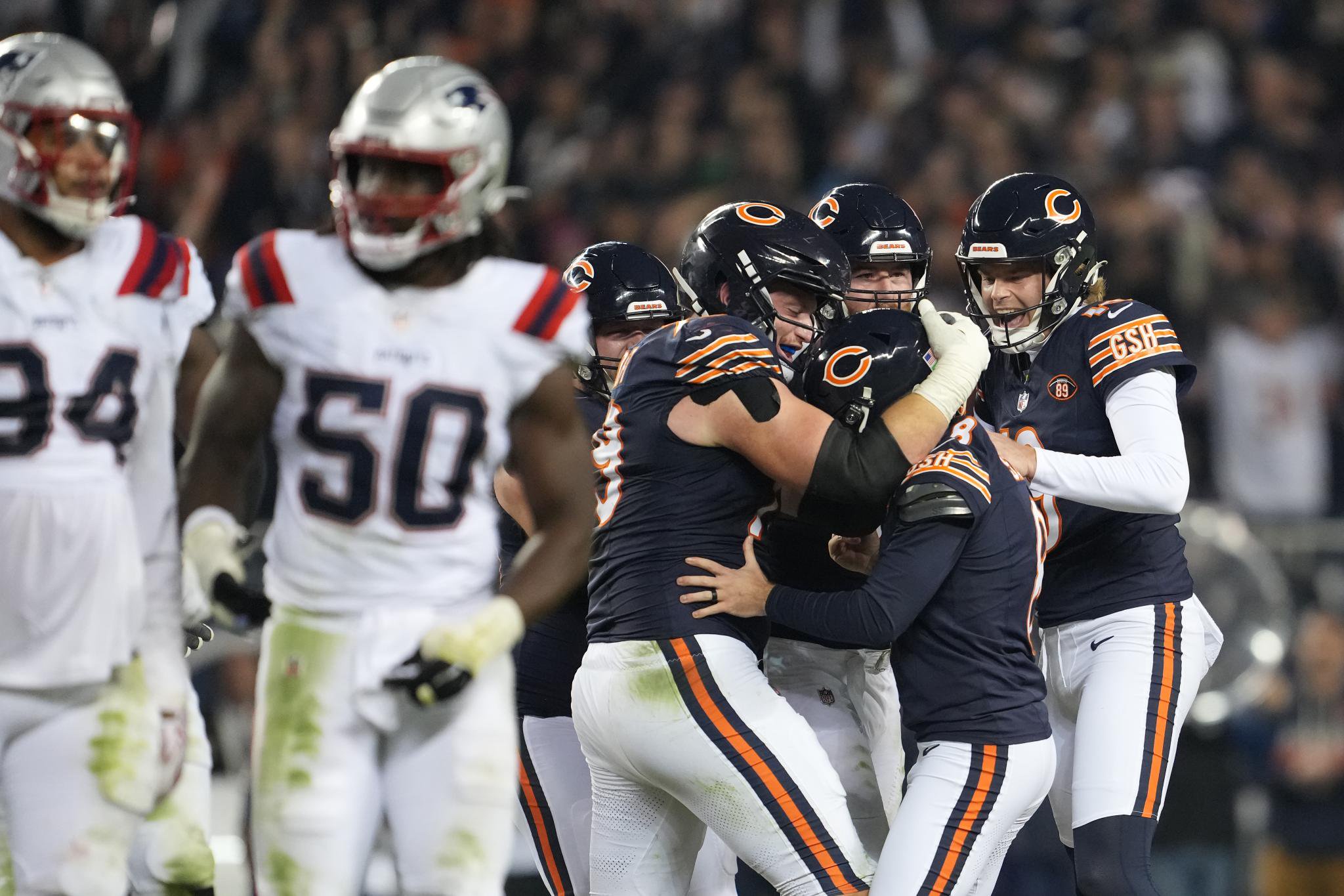 Chicago Bears kicker Cairo Santos celebrates with teammates after kicking a field goal against the New England Patriots.