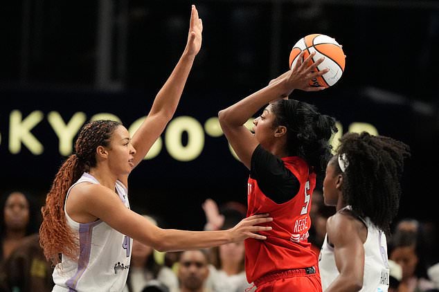 Atlanta Dream's Angel Reese (5) looks to pass past Golden State Valkyries' Juste Jocyte during the first half of Game 6 of the WNBA basketball finals on Thursday, Oct. 29, 2026, in Atlanta. (AP Photo/Brynn Anderson)