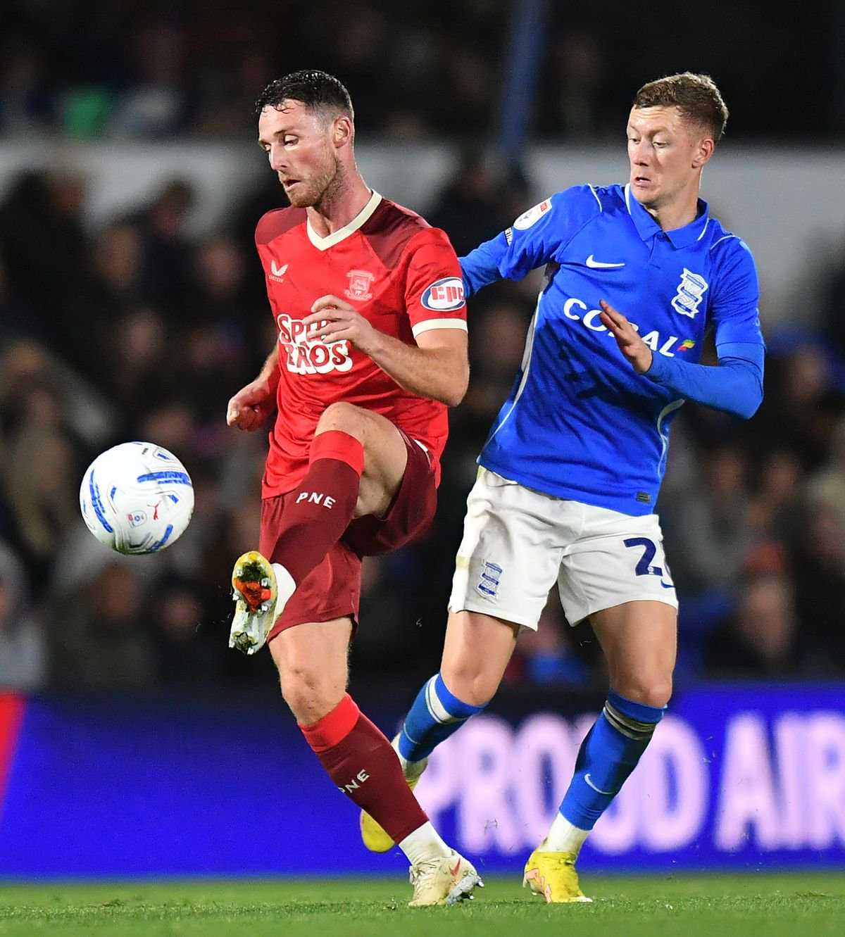 Preston North End's Jordan Thompson battles with Birmingham City's Jay Stansfield