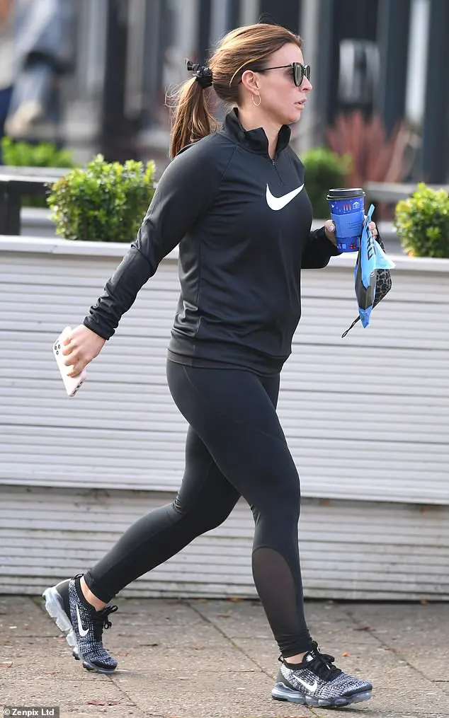 Sporty: The mother-of-four, 34, cut a sporty figure for her outing, donning form-fitting black workout gear that included leggings and a long-sleeved top