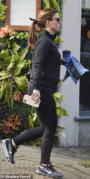 Ensemble: She complemented her all-Nike ensemble with a pair of grey running shoes