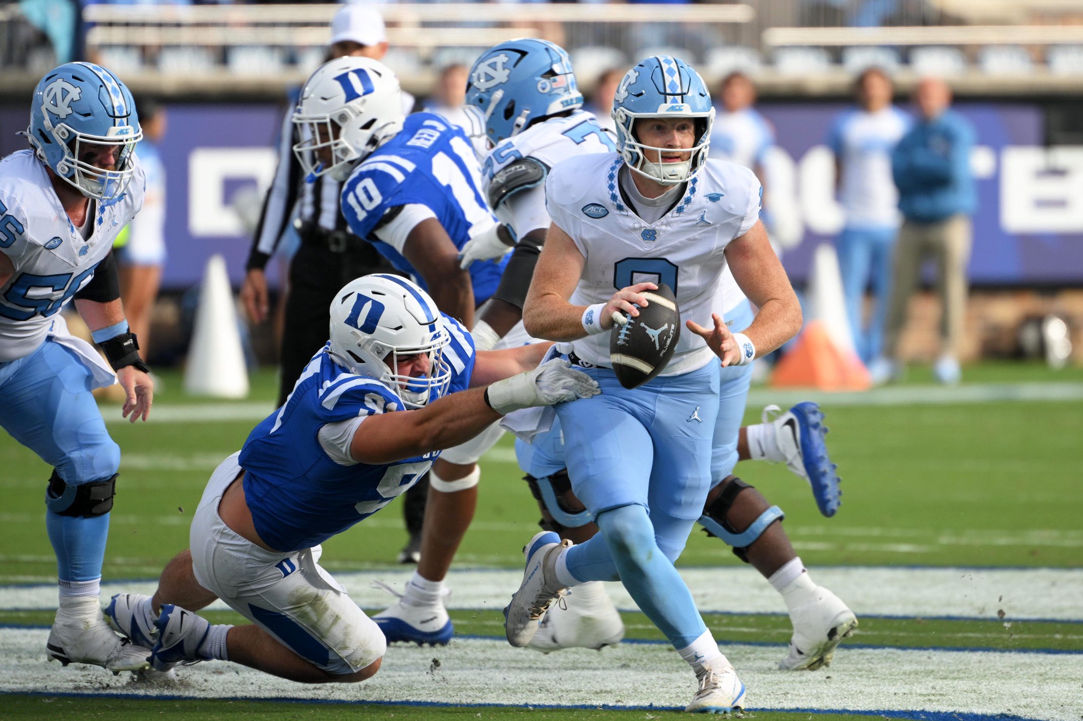 Oct 17, 2026; Durham, North Carolina, USA;  North Carolina Tar Heels quarter back Billy Edwards Jr. (9) looks to pass  against Duke Blue Devils defensive tackle Owen Wafle (91) during the first quarter at Wallace Wade Stadium.  Mandatory Credit: Zachary Taft-Imagn Images