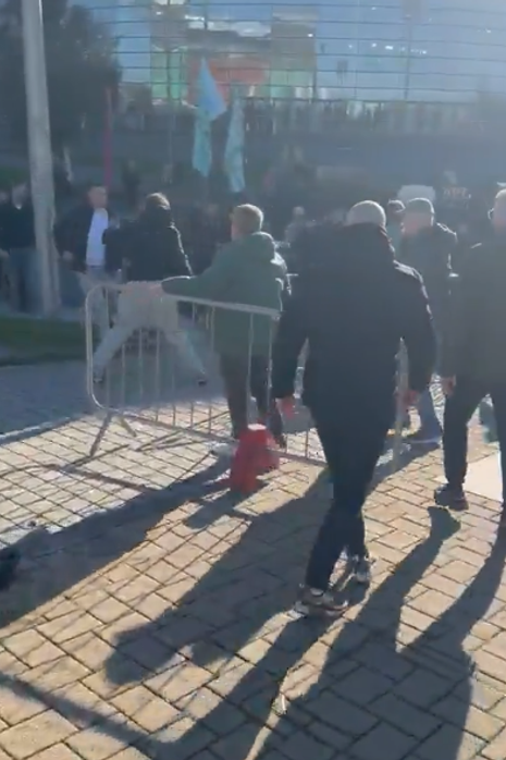 Fans clashing outside Celtic Park. 