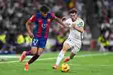 Lamine Yamal of FC Barcelona competes for the ball with Brahim Diaz of Real Madrid CF during the LaLiga EA Sports match between Real Madrid CF and ...