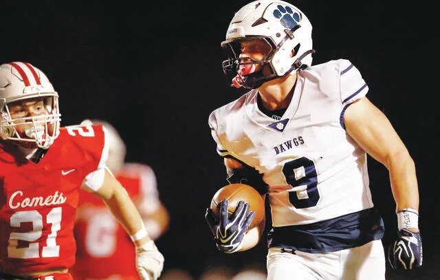 <p>Berwick tight end Gabe Decker runs down the sideline with Crestwood’s Jake Jeckell in pursuit in the first quarter on Friday night.</p>
                                 <p>Fred Adams | For Times Leader</p>