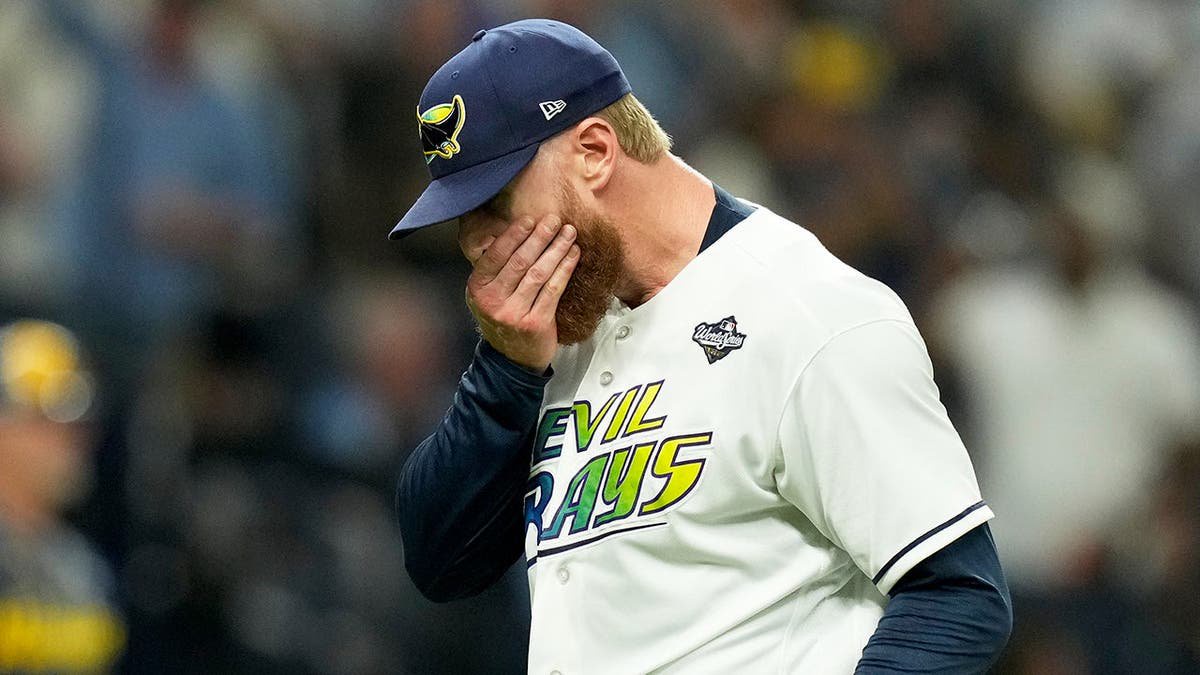 Cam Booser leaves the game during the fifth inning of the World Series.