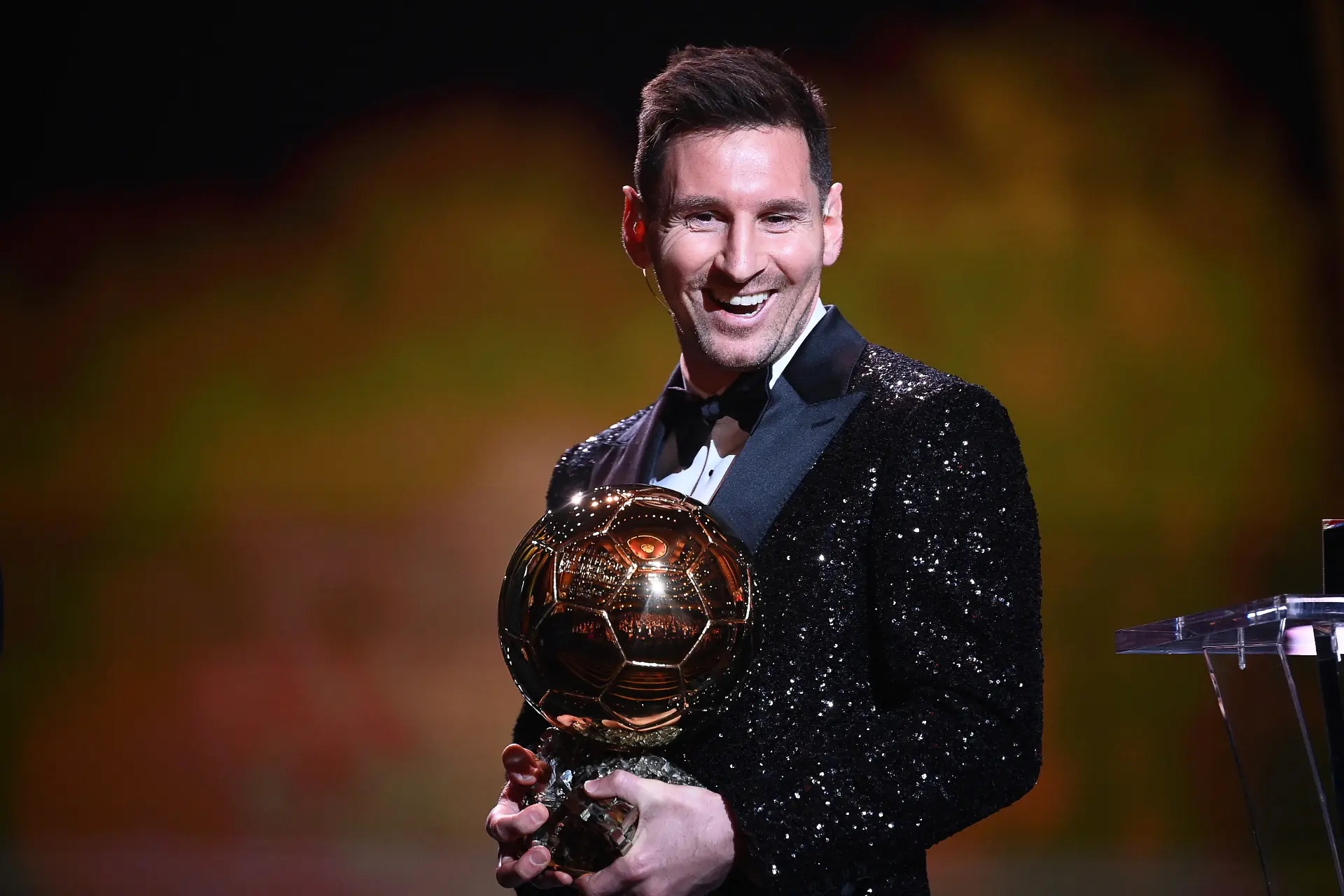 Lionel Messi holding the Ballon d’Or.
