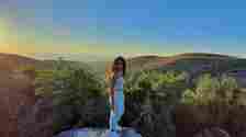 Maria Shaya Maria Shaya standing on a rock overlooking a beautiful valley in August 2020