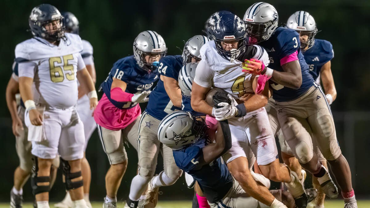 Stratford’s defense stops Asa Wall (4) on third down to end a promising drive. Despite that play, Wall was a one-man wrecking crew against Stratford in the Trojans’ 28-20 road win Friday.