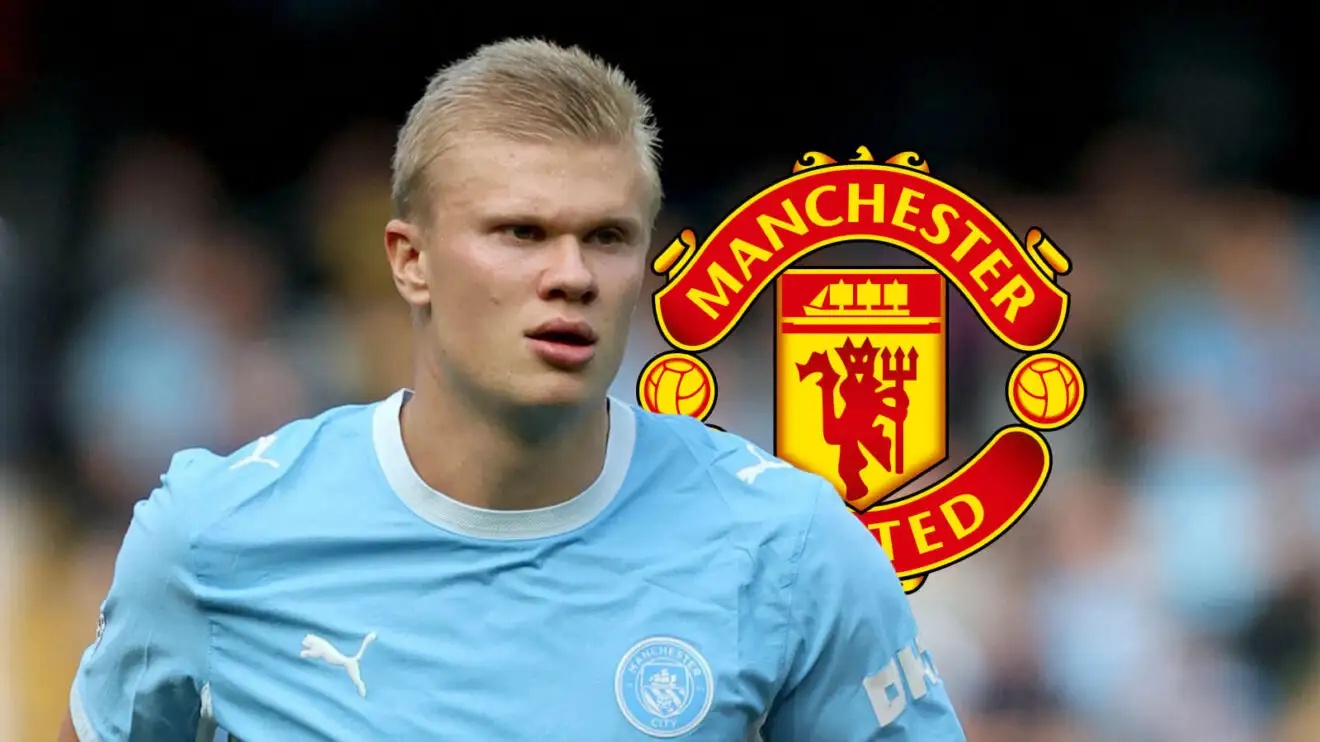 Man City striker Erling Haaland with a Man Utd badge