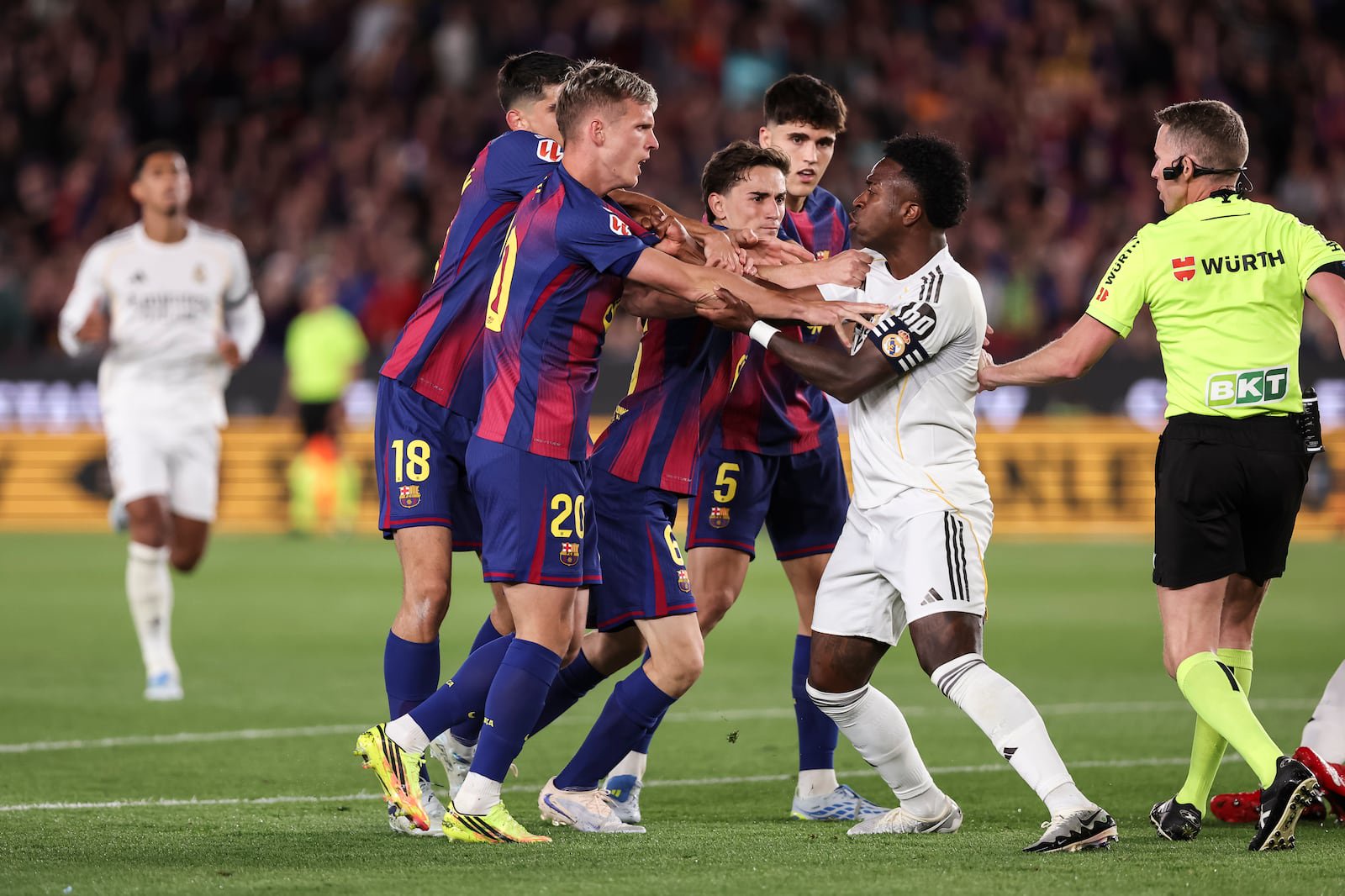 Barcelona players leave Real star Vinícius Júnior in no doubt about their feelings during May's El Clásico. Photograph: Javier Borrego/Getty