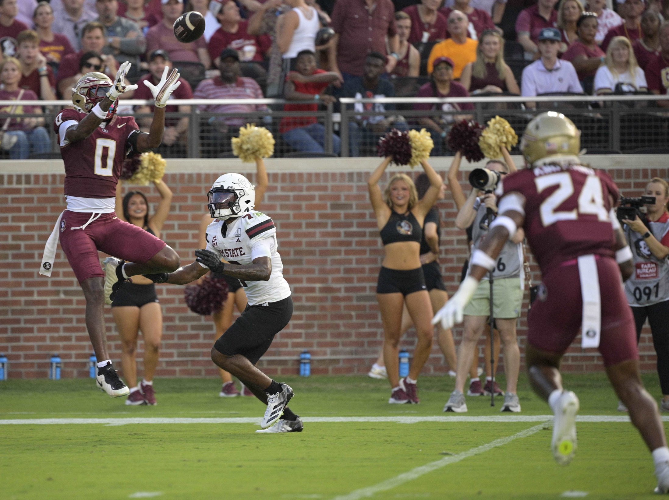 Aug 29, 2026; Tallahassee, Florida, USA;  Florida State defensive back Quindarrius Jones (0) catches an interception as New Mexico State wide receiver TJ Pride (7) defends during the first quarter at Doak S. Campbell Stadium.  Mandatory Credit: Melina Myers-Imagn Images