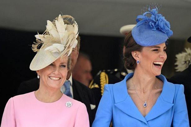 Kate and sophie with hats laughing