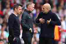 Manchester City manager Josep Guardiola speaks to the fouth official as Fulham manager Marco Silva looks on during the Premier League match between...