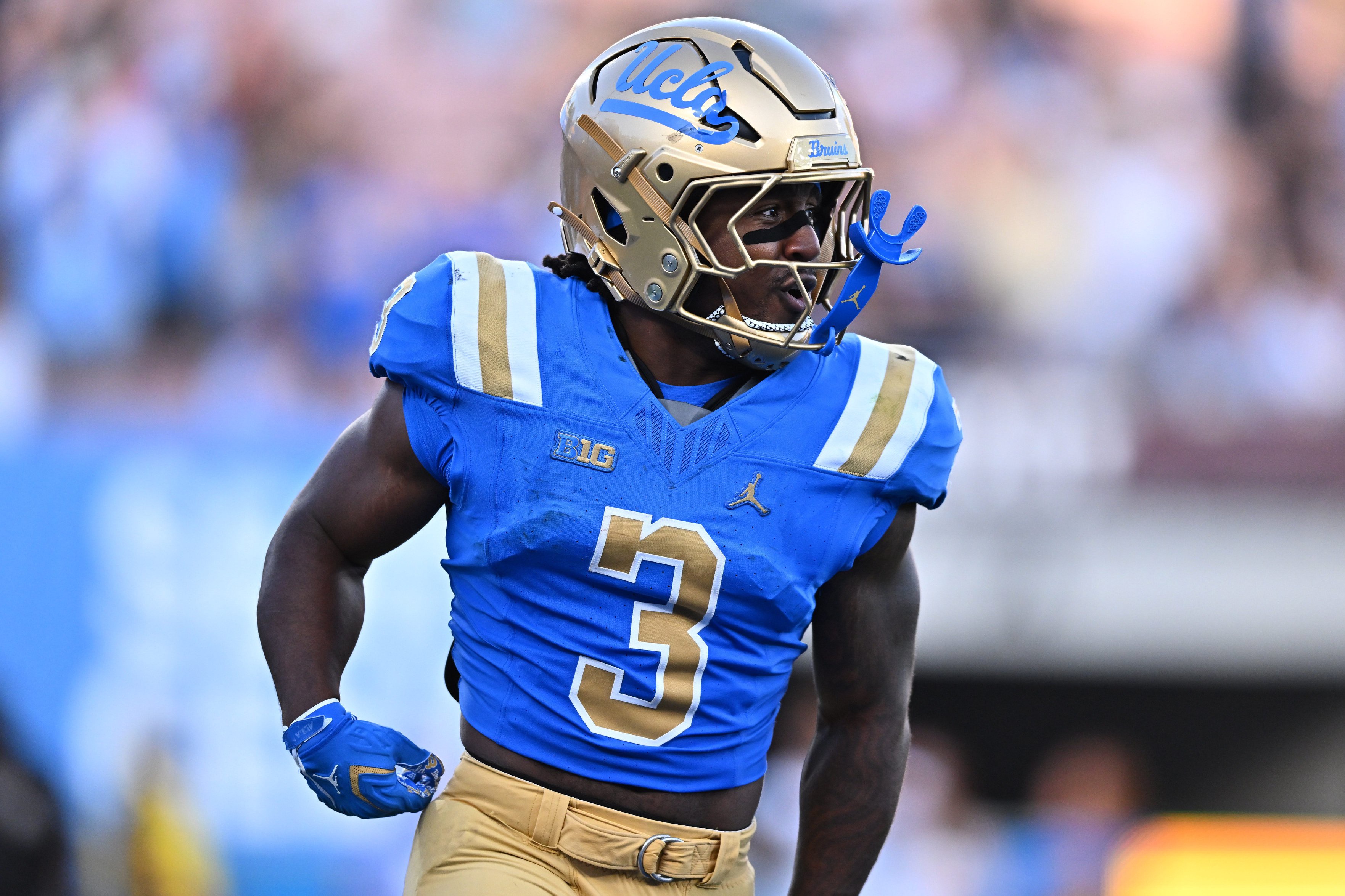 UCLA running back Wayne Knight (3) celebrates a touchdown during the second half against San Diego State at the Rose Bowl.