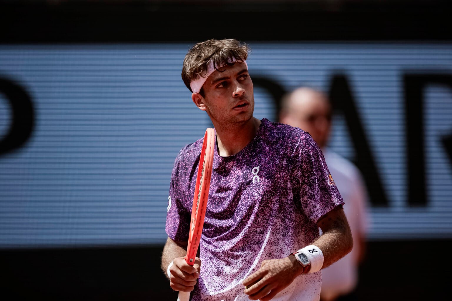 Flavio Cobolli reacts at Roland Garros.