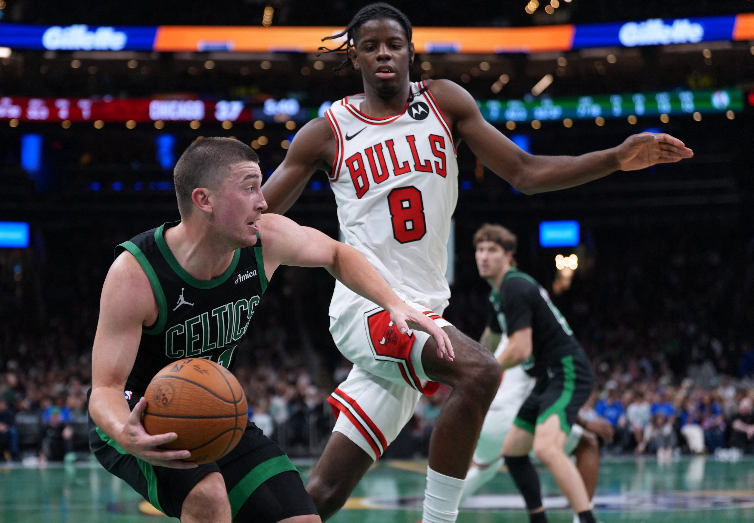 Oct 30, 2026; Boston, Massachusetts, USA; Boston Celtics guard Payton Pritchard (11) drives the ball against Chicago Bulls forward Caleb Wilson (8) in the second quarter at TD Garden. Mandatory Credit: David Butler II-Imagn Images