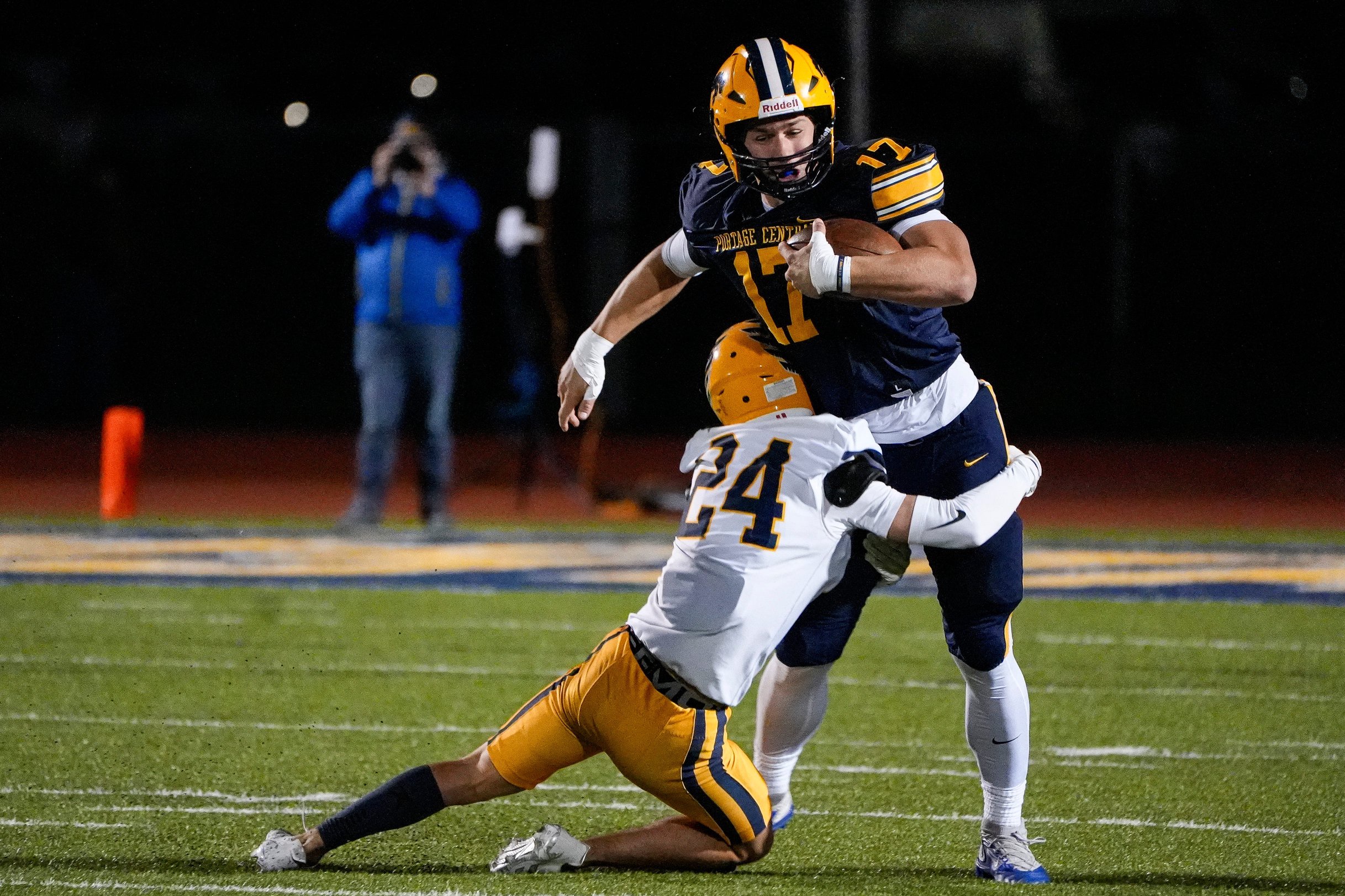 Portage Central’s Aiden Huber makes a catch against Hudsonville defensive back Maxton Heintskill during the first half at Portage Central High School in Portage on Friday, Oct. 30, 2026.