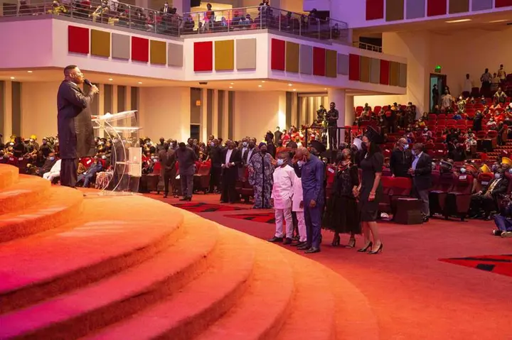 Pastor Mike Okonkwo while praying for the family of the deceased at the night of tributes held in Lagos