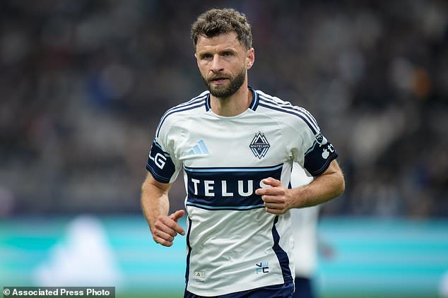 Vancouver Whitecaps' Thomas Muller prepares to take a corner kick during the second half of an MLS soccer match against San Diego FC, in Vancouver, British Columbia, Wednesday, Oct. 28, 2026. (Darryl Dyck/The Canadian Press via AP)