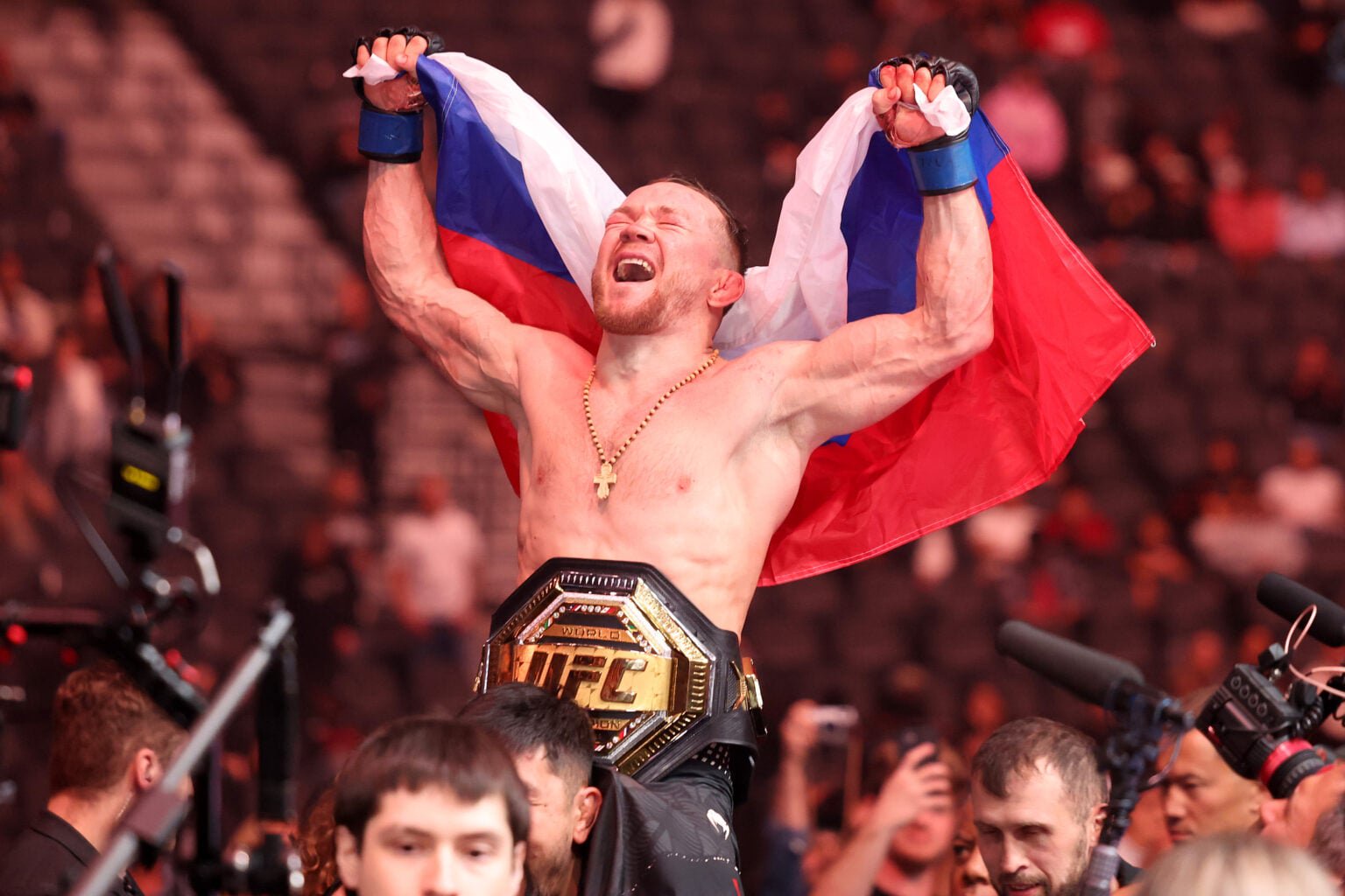 Petr Yan celebrates his UFC 323 win