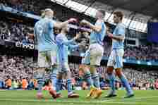 Erling Haaland of Manchester City celebrates with his team mates after scoring a goal to make it 3-0 during the Premier League match between Manche...