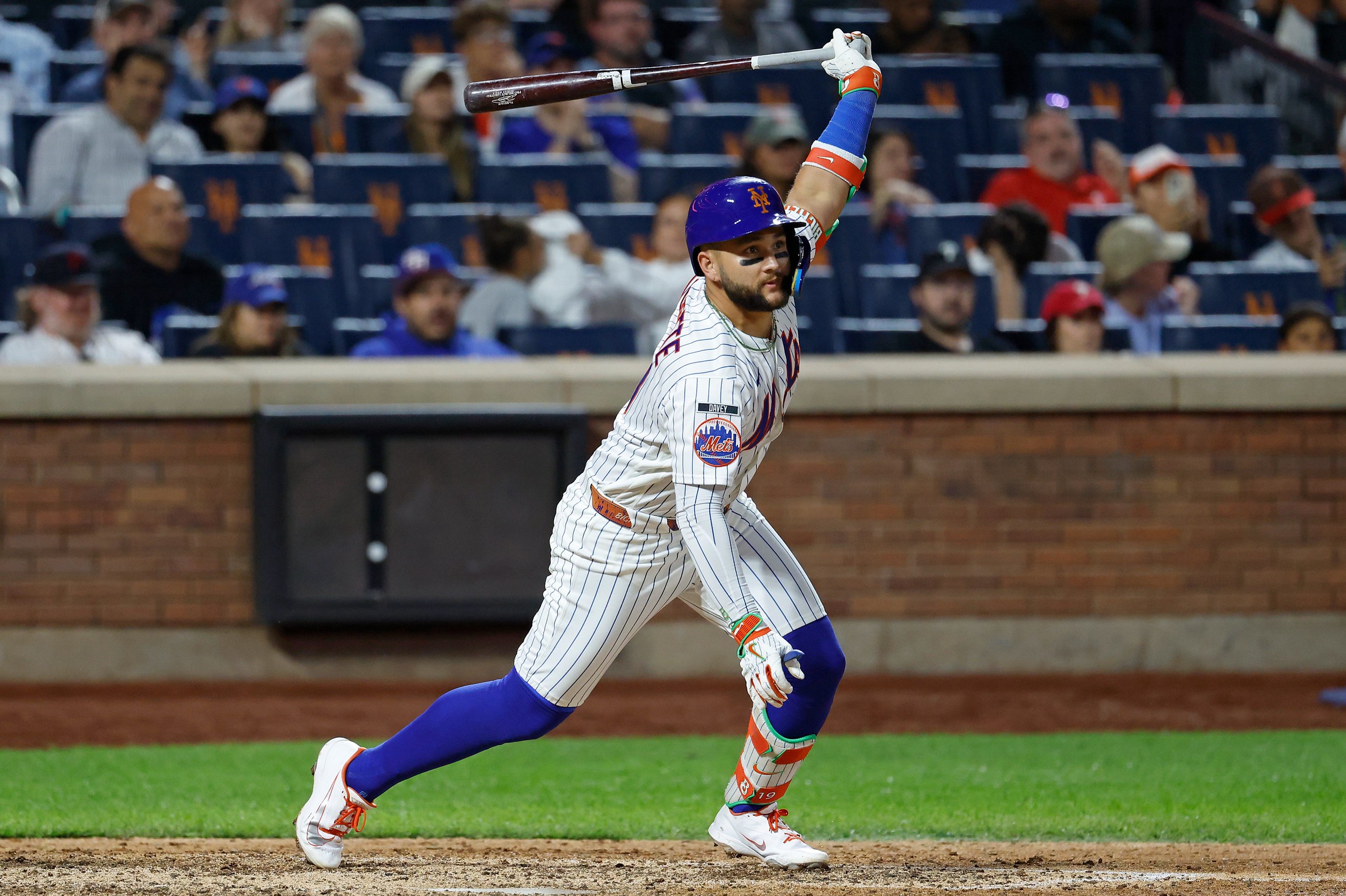 New York Mets third baseman Bo Bichette hits an RBI single in the eighth inning against Citi Field.