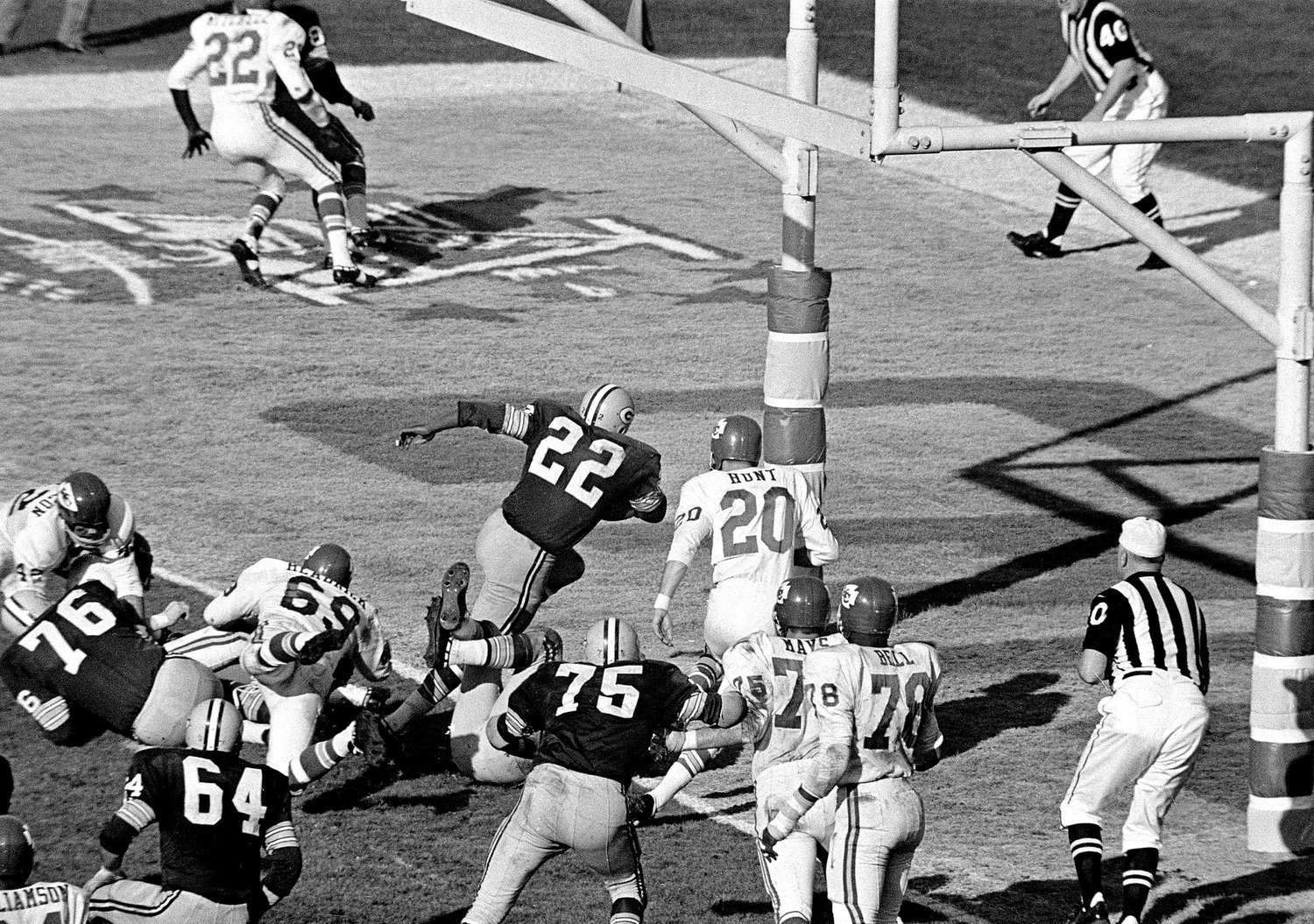 Green Bay's Elijah Pitts (22) charges into the end zone, eluding Bobby Hunt (20), during the first Super Bowl in Los Angeles, Jan. 16, 1967. Pitts scored from the five on the play following Willie Wood's interception in the third quarter. Packers beat the Chiefs, 35-10.