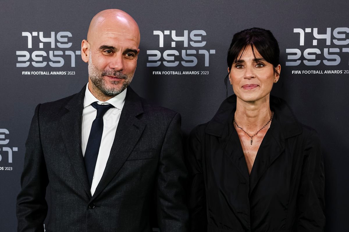 Manchester City Head Coach Pep Guardiola and Cristina Serra poses for photos during the Green Carpet Arrivals at The Apollo Theatre on January 15, 2024 in London, England. 