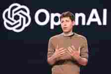 Sam Altman speaking at an OpenAI conference