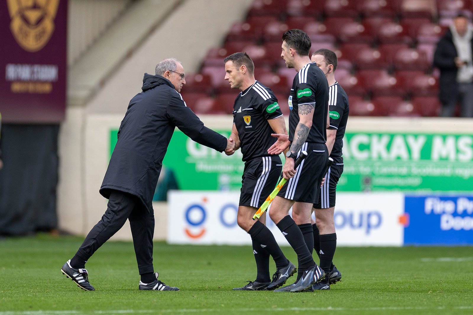 Handshakes with the match officials at full time at Fir Park