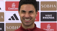 Mikel Arteta pictured with a massive smile during a press conference