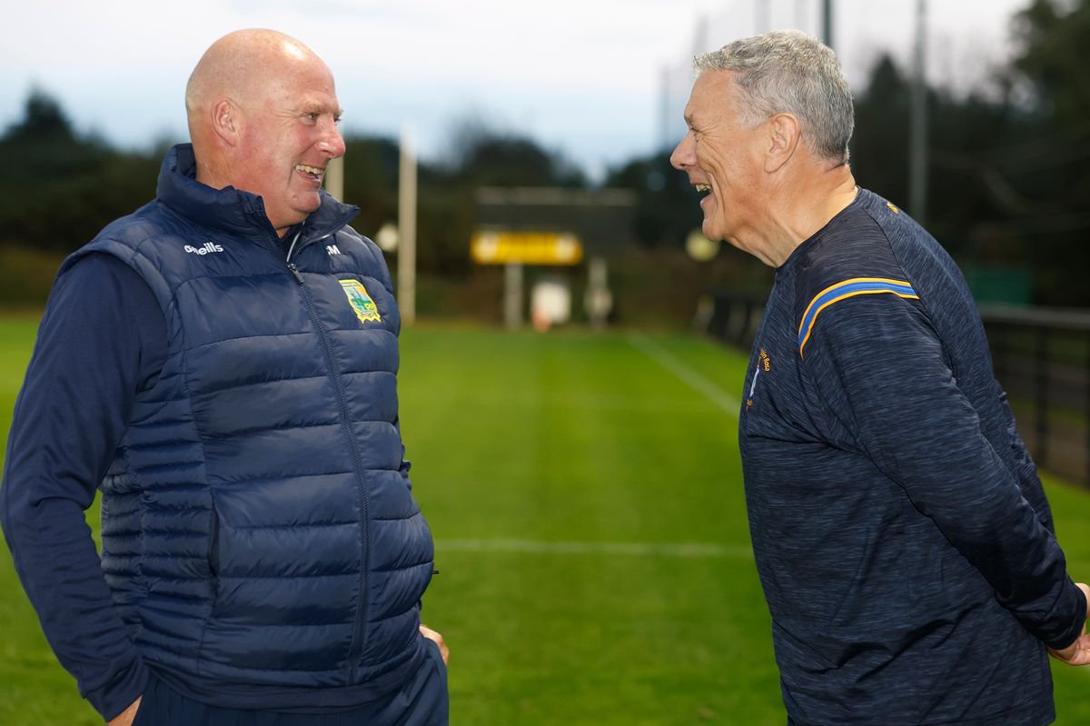 Rossa manager Sean Fleming (right) shares a joke with St Brigid's boss Cathal Murray during Monday night's Antrim SFC final press event at Dunsilly