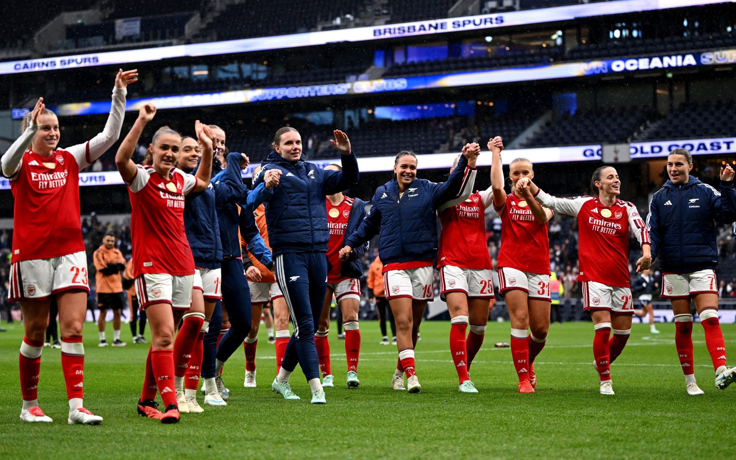 Arsenal players celebrate at full time