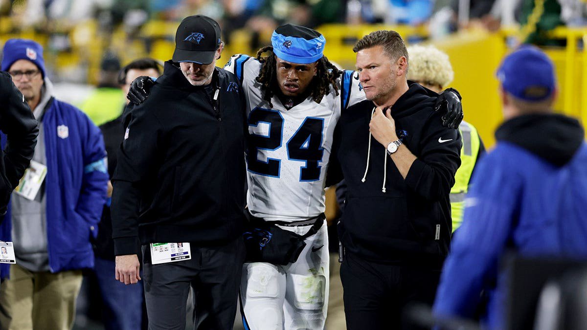 Will Lee III is helped from the field after an injury during an NFL game.