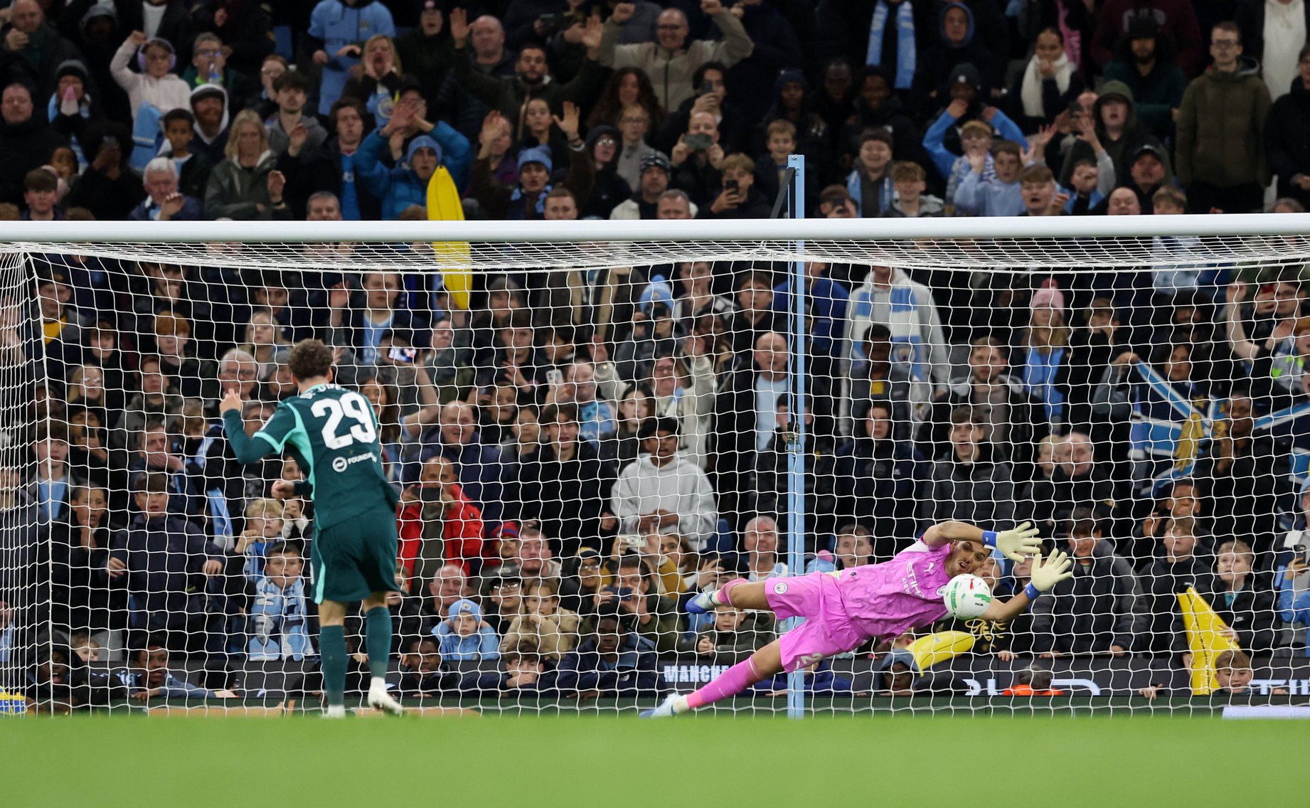 Geronimo Rulli made two saves in the shootout to take Manchester City through