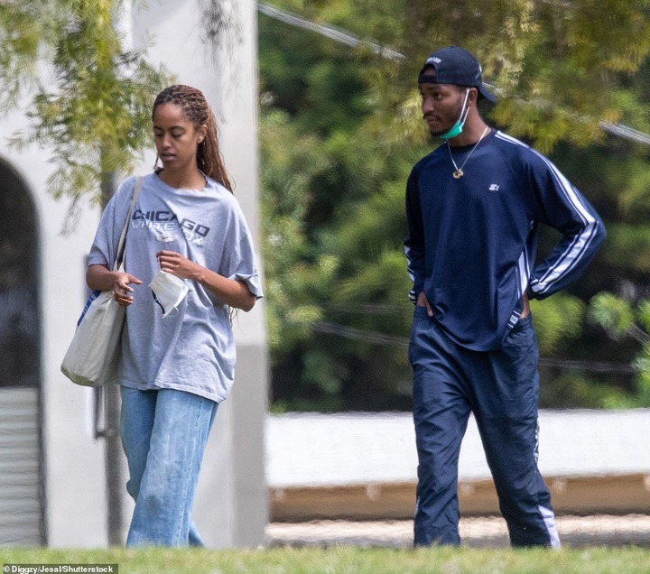 The former college basketball star was seen spending time with Sasha's older sister Malia in Los Angeles on Sunday, with the pair enjoying a casual stroll through a public park together, before taking a brief break so the former First Daughter could smoke.
