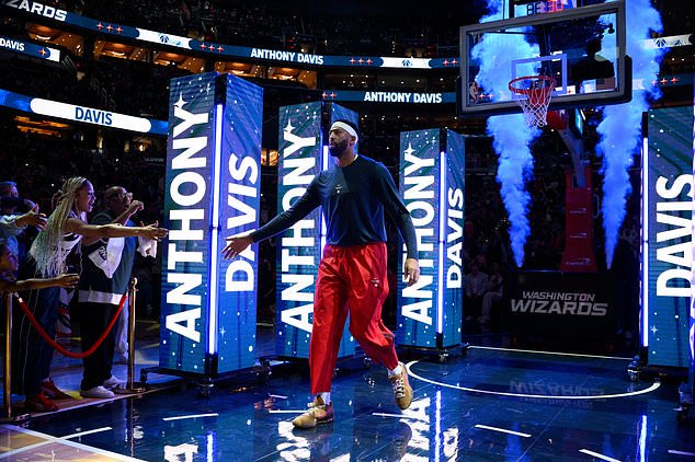 Washington Wizards forward/center Anthony Davis is introduced before an NBA basketball game against the Milwaukee Bucks, Wednesday, Oct. 21, 2026, in Washington. (AP Photo/Nick Wass)