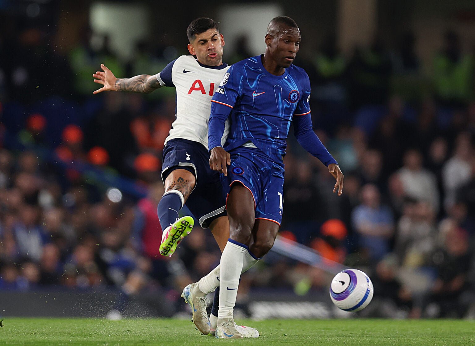 Nicolas Jackson of Chelsea in action against Cristian Romero of Tottenham Hotspur