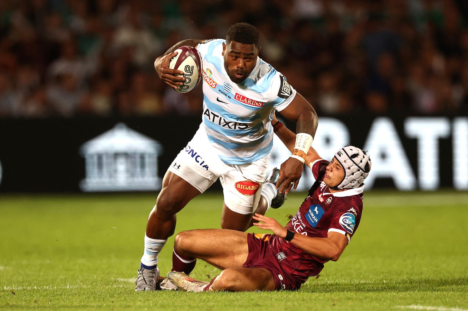 Racing 92's Fijian center Josua Tuisova is tackled by Bordeaux Bègles' French wing Louis Bielle-Biarrey. Photograph: Romain Perrocheau/AFP via Getty