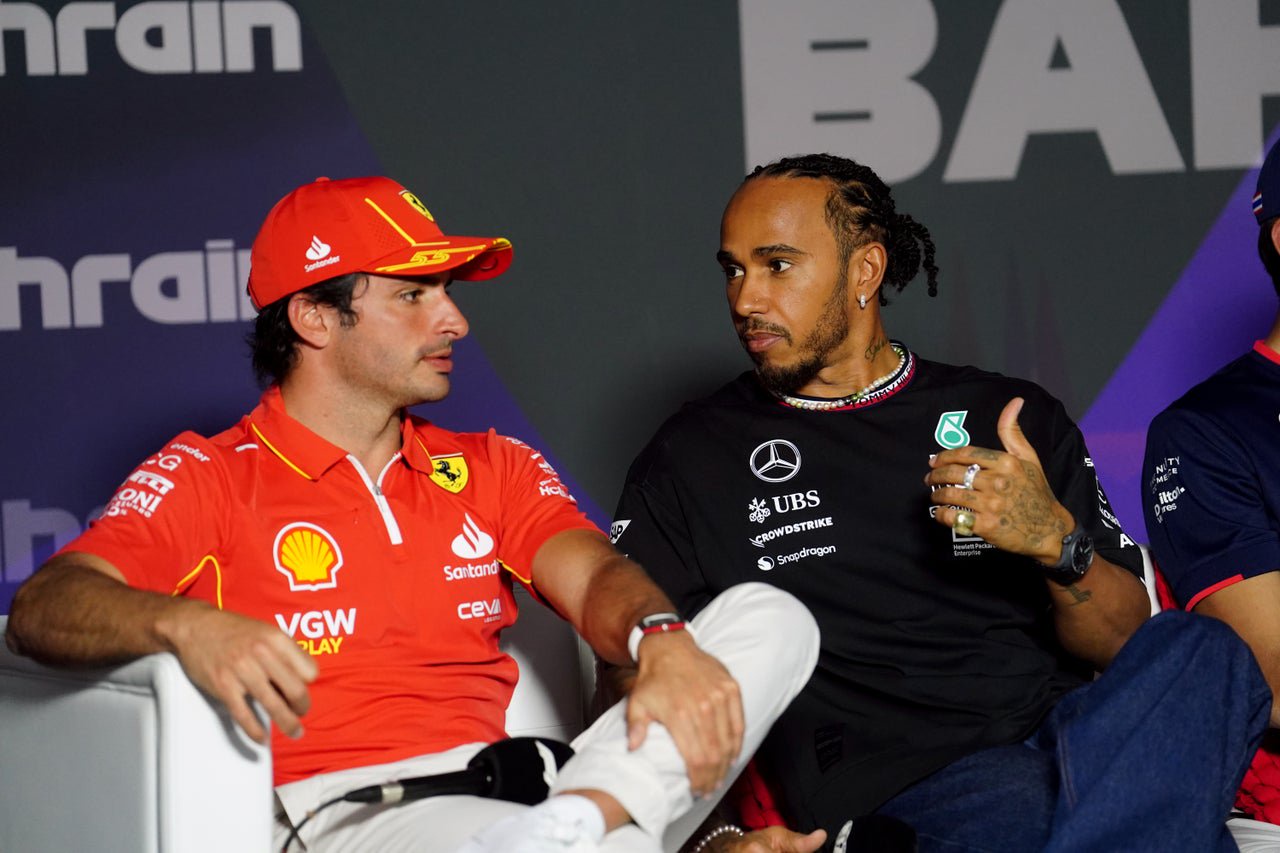 Carlos Sainz speaks to Lewis Hamilton in a conversation picked up by Netflix in Drive to Survive (David Davies/PA Wire)