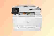 HP Color LaserJet Pro M283fdw printer on orange background
