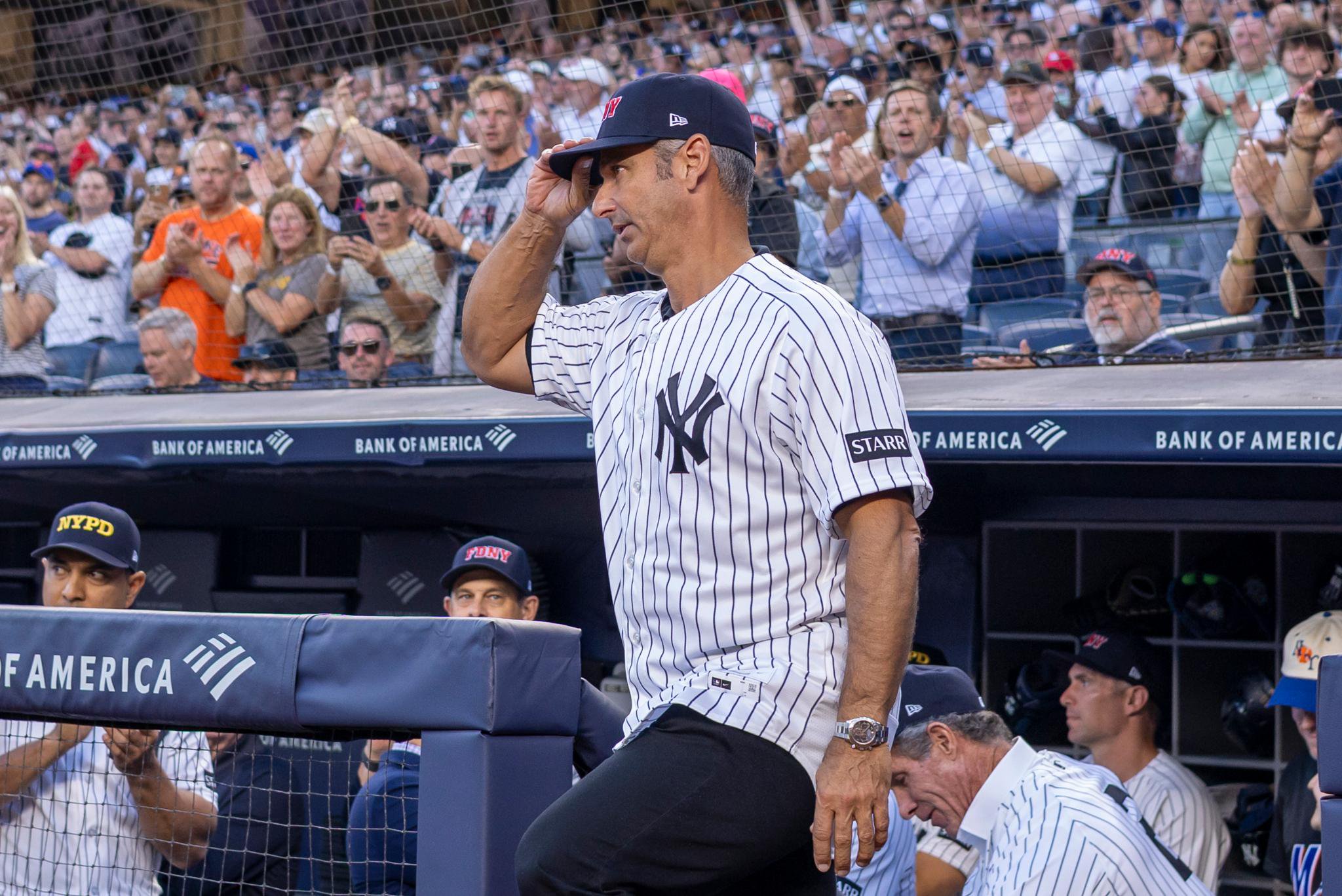Former New York Yankees player Jorge Posada takes the field for a pregame ceremony at Yankee Stadium.